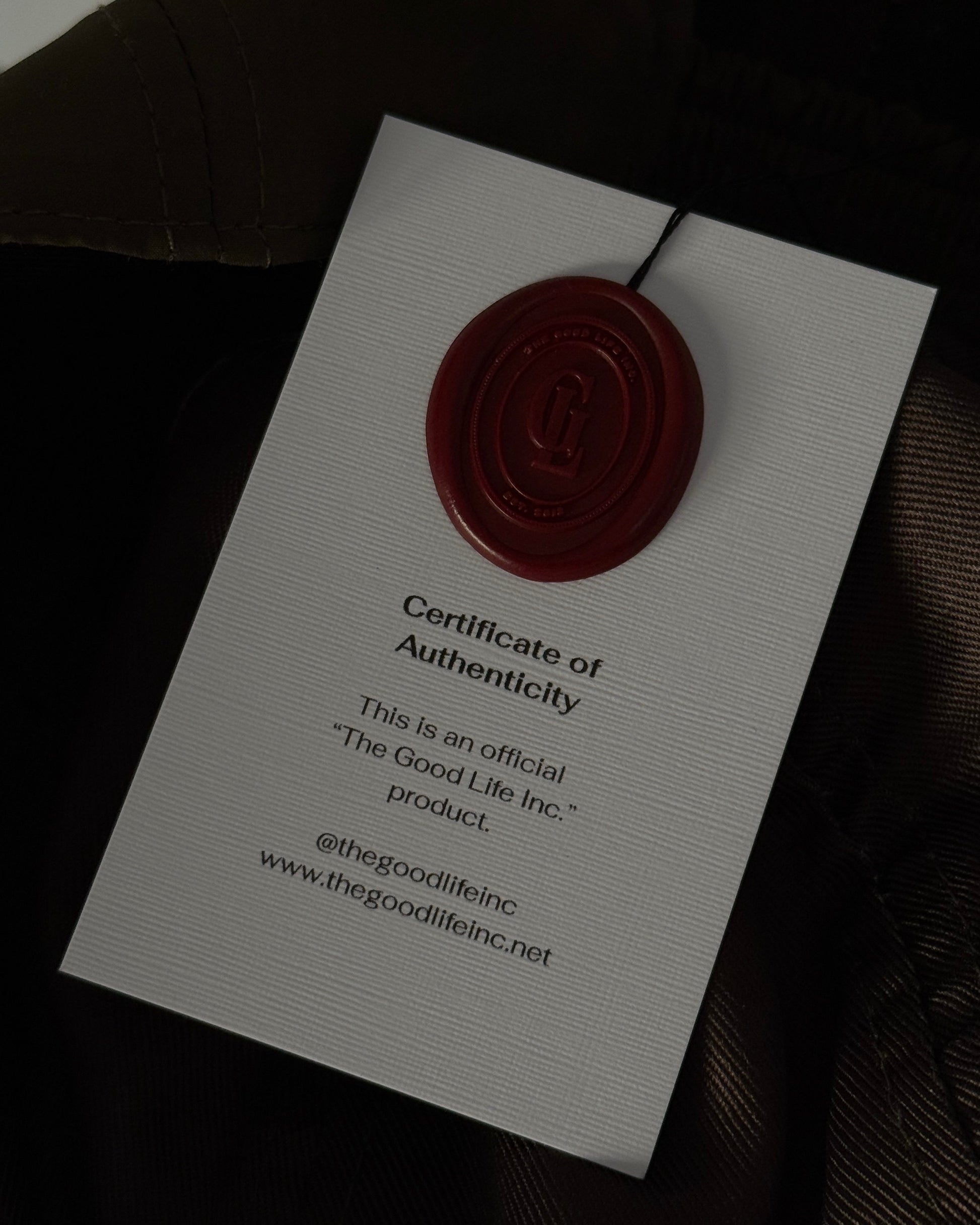 Certificate of Authenticity from The Good Life Inc. with a red wax seal on a linen card.