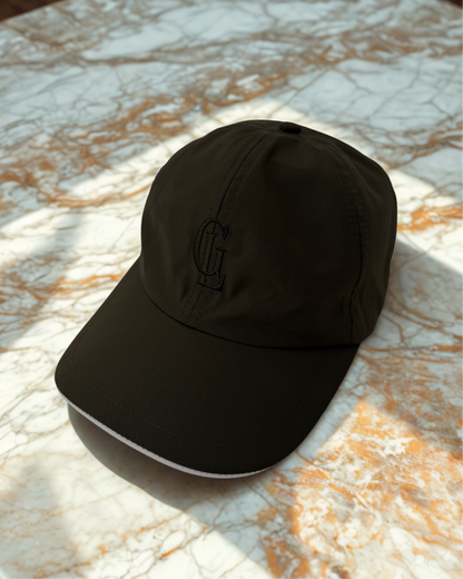 Olive green cap on a marble surface