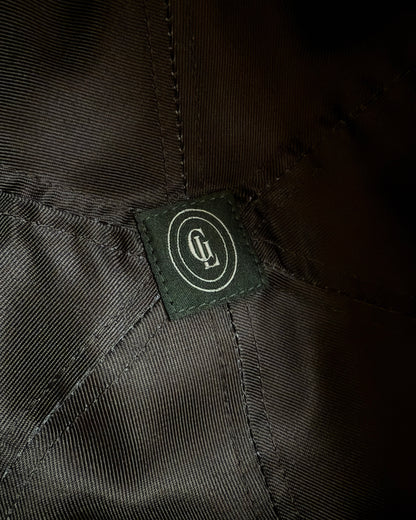 Close-up of a brand label on a dark fabric background